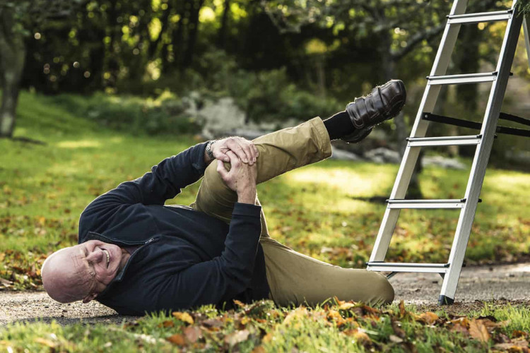 An individual loses their balance and tumbles off a ladder while cleaning gutters in narooma.